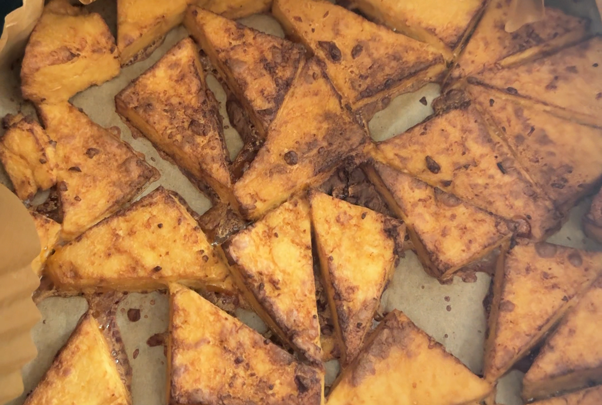 Crispy puffy air fryer tofu triangles with a golden crust